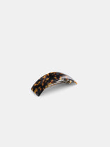 The Rectangle Volume Hairclip, handcrafted from curved acetate in Oyonnax, France, showcases a brown and black tortoiseshell pattern, set against a plain white background.