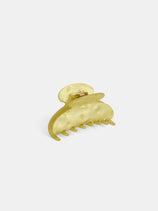The Large Round Claw is a yellow, translucent acetate hair accessory featuring interlocking teeth and a curved design, shown against a plain white background.