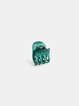 The Small Round Claw, a handcrafted green marbled acetate hair accessory with curved prongs and a gold-toned spring hinge, made in France, is shown upright on a plain white background.