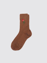 The Maria La Rosa Iris Sock in brown features a small embroidered red flower with a green stem near the top, shown on a light gray background—ideal for those seeking distinctive Italian artisan socks.
