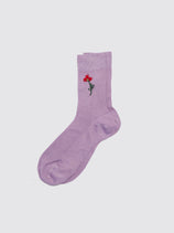 The Maria La Rosa Iris Sock is a light purple Italian artisan sock featuring a small embroidered red flower with a green stem near the ankle, shown against a simple light background.