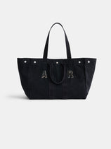 The Perfect Weekend Tote: a large black cotton bag with dual handles, silver rivets on top, and “A R” stitched in front—a stylish monogrammable tote ideal for daily use.