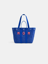 The Perfect Weekday Tote is a blue personalized bag with two handles and "MOM" in red on the front—ideal for anyone seeking a stylish, customizable tote.