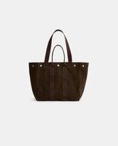 The Painted Perfect Weekday Tote—a dark brown canvas bag featuring two short handles, two long shoulder straps, and silver button accents—is ideal for those seeking personalized totes and is displayed against a plain white background.