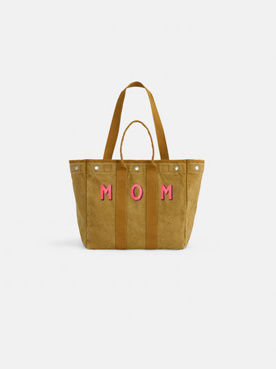 The Perfect Weekday Tote: a tan cotton bag with two handles and bold pink "MOM" lettering on the front, ideal for personalization, shown on a plain white background.
