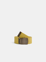The Solid Web Belt, featuring a rolled-up yellow striped design and a rectangular metallic buckle, stands upright against a plain white background.