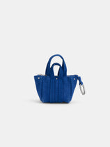 The Teeny Tiny Tote Keychain is a small, bright blue mini tote with two short handles, vertical stitching, a zipper closure, and a metal keyring on the right side—ideal as a functional keychain pouch—shown against a plain white background.