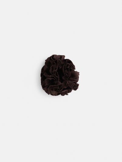 The Frisee Hair Scrunchie in Linen, a sustainable dark brown ruffled fabric accessory, is shown against a plain white background.