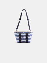 The Painted Striped Mini is a small blue-and-white striped tote bag with navy handles, shoulder strap, and an M logo on the front pocket, shown against a plain white background.
