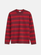 The Matt Striped Tee is a relaxed fit, long-sleeve crew neck t-shirt with horizontal navy blue and red stripes on a red background, shown flat on a white surface.