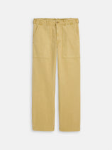 The Field Pant In Herringbone features a khaki hue, straight-leg cut, large front patch pockets, and visible seams. Made from durable herringbone cotton, the pants are shown flat on a white background.