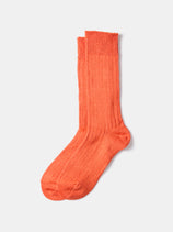 A pair of RoToTo Linen Cotton Ribbed Crew Socks in orange, made in Japan, displayed flat on a light gray background.