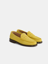 The Sesa New York Loafer Sister In Suede, shown in yellow suede with brown soles and a classic penny strap detail, is displayed against a plain white background.