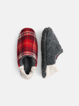 A pair of Sherpa House Shoes featuring cozy, machine washable design with red plaid fabric on top, white trim accents, and gray fuzzy soles, displayed in both top and side views against a white background.