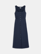 The Piper Dress in Cotton is a sleeveless, navy blue midi dress with a square neckline and button-down front, shown flat on a white background for a flattering fit.