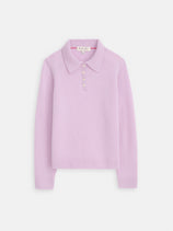 The Alice Polo In Cashmere is a light purple, 100% cashmere long-sleeve sweater with a collared neckline and four gold buttons on the placket, shown flat on a white background.