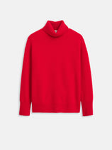 The Maisie Turtleneck Sweater in Cashmere is a bright red women's luxury sweater with long sleeves, ribbed cuffs and hem, and a relaxed fit, displayed against a plain white background.