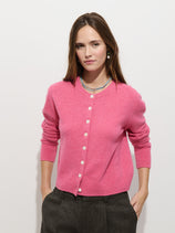 The Elizabeth Street Cardigan in Merino Wool is a relaxed fit women’s cardigan in pink extrafine merino wool, featuring a button-up front and three-quarter length sleeves.