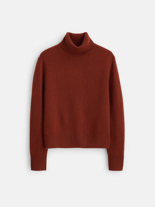 Blair Turtleneck Sweater in Washed Cashmere in a rust-colored turtleneck style with long sleeves and ribbed cuffs and hem.